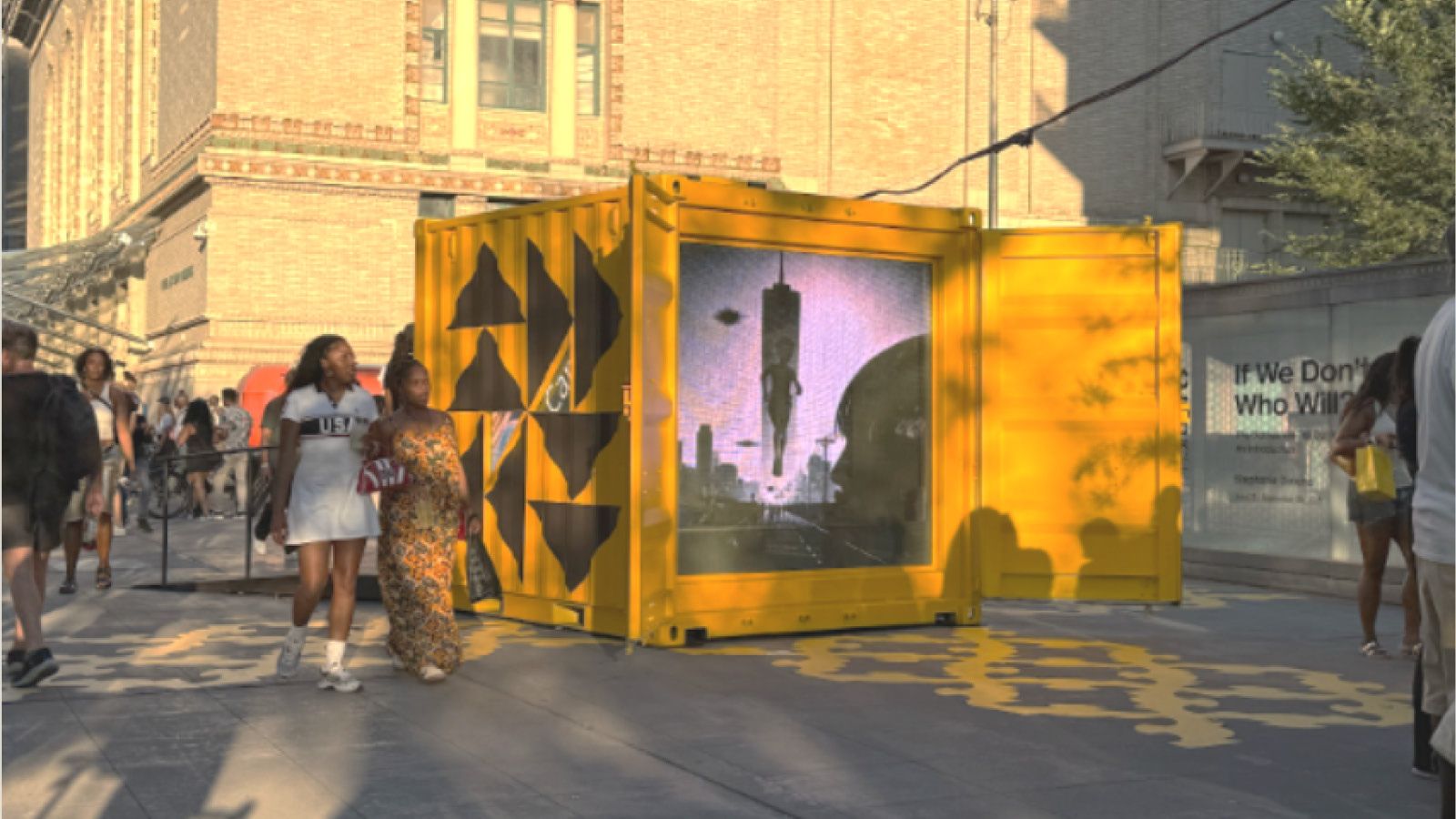 People on street walking by a public AI art installation.