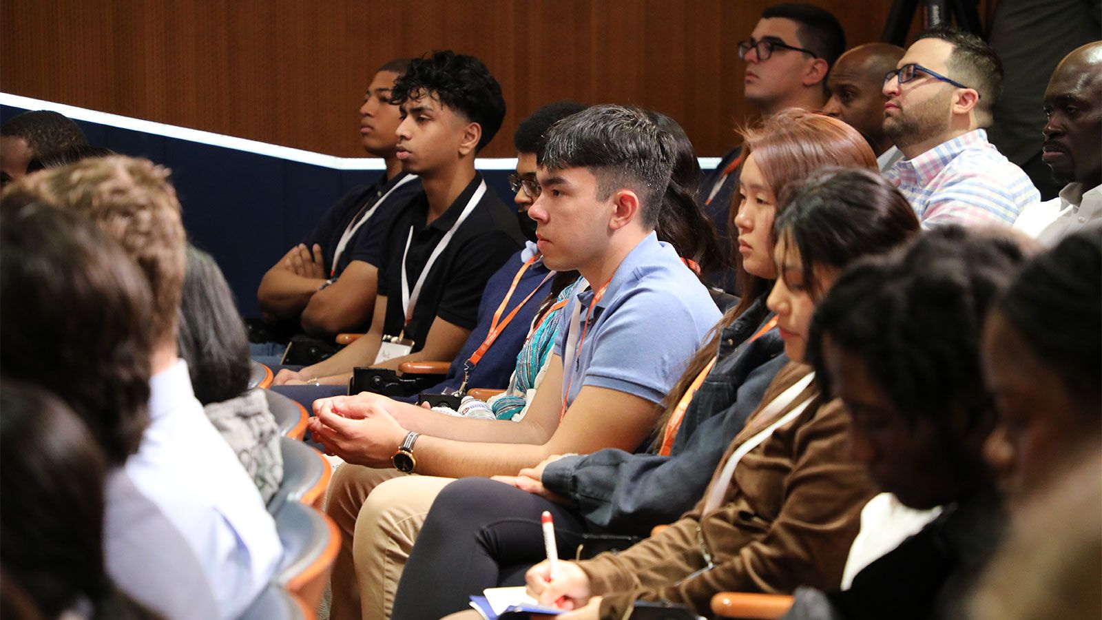 engaged hunter student crowd at Deloitte event