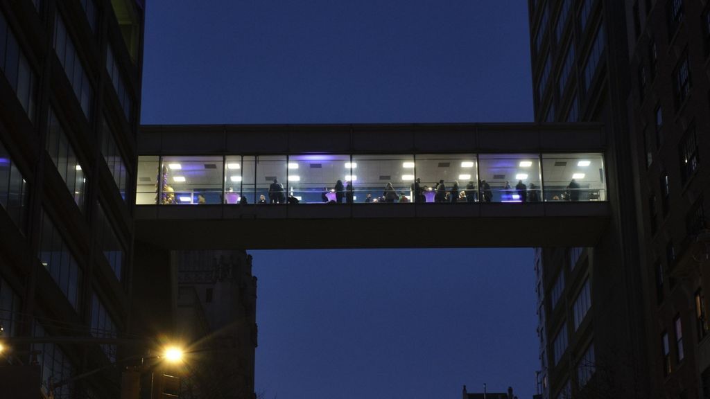 The 7th floor skybridge lit for the Young Alumni Mixer.