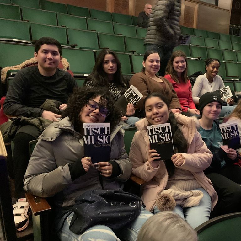 Hunter students smile with a program at 92Y.