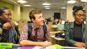 Photo of Hunter at the counter in the library