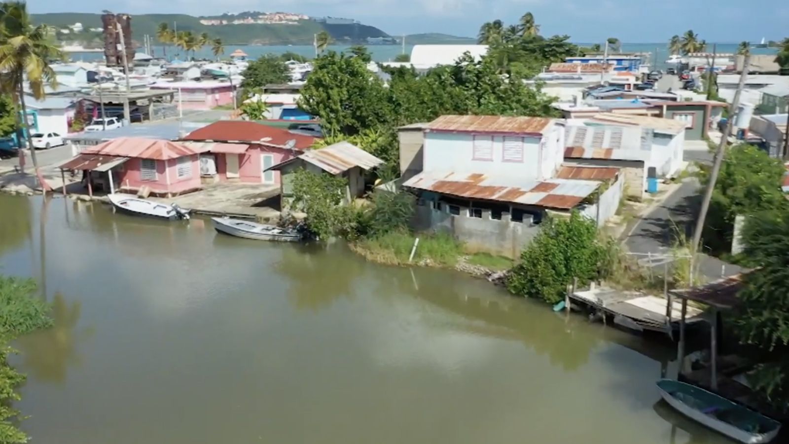 Image showing a river with boats and houses