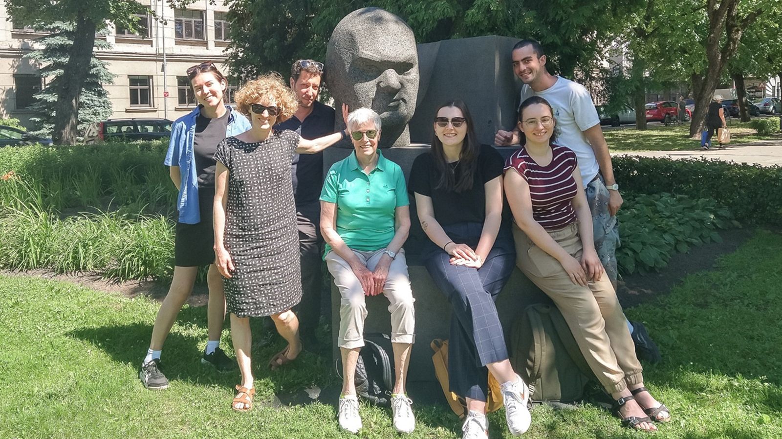 From left, Alexandra Aguirre, Ainsley Morse, Prof. Yasha Klots, Gail Landis, Diana Gor, Sophie Shields, and Seneca Petry at a monument to author Aleksandrs Čaks in Riga.