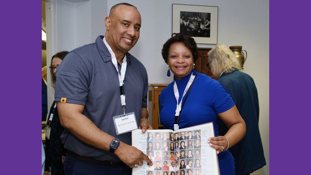 Aliba Marson-Quinones points out Candice Y. Williams Hall ’00 in her yearbook.