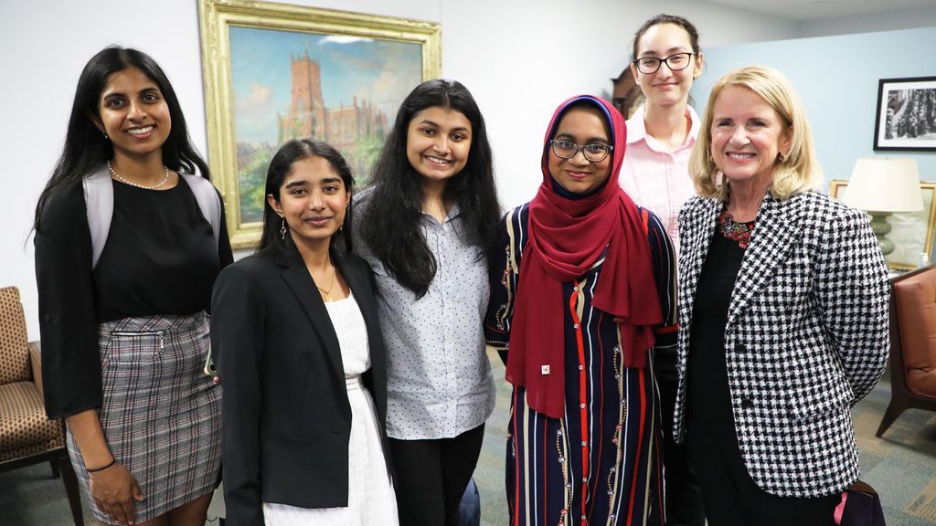 Anne Welsh McNulty (right) poses with McNulty scholars (from left) Pooja Suganthan, Masuda Begum, Sangita Chakraborty, Afsana Rahman, and Greta Henriette Ghita.