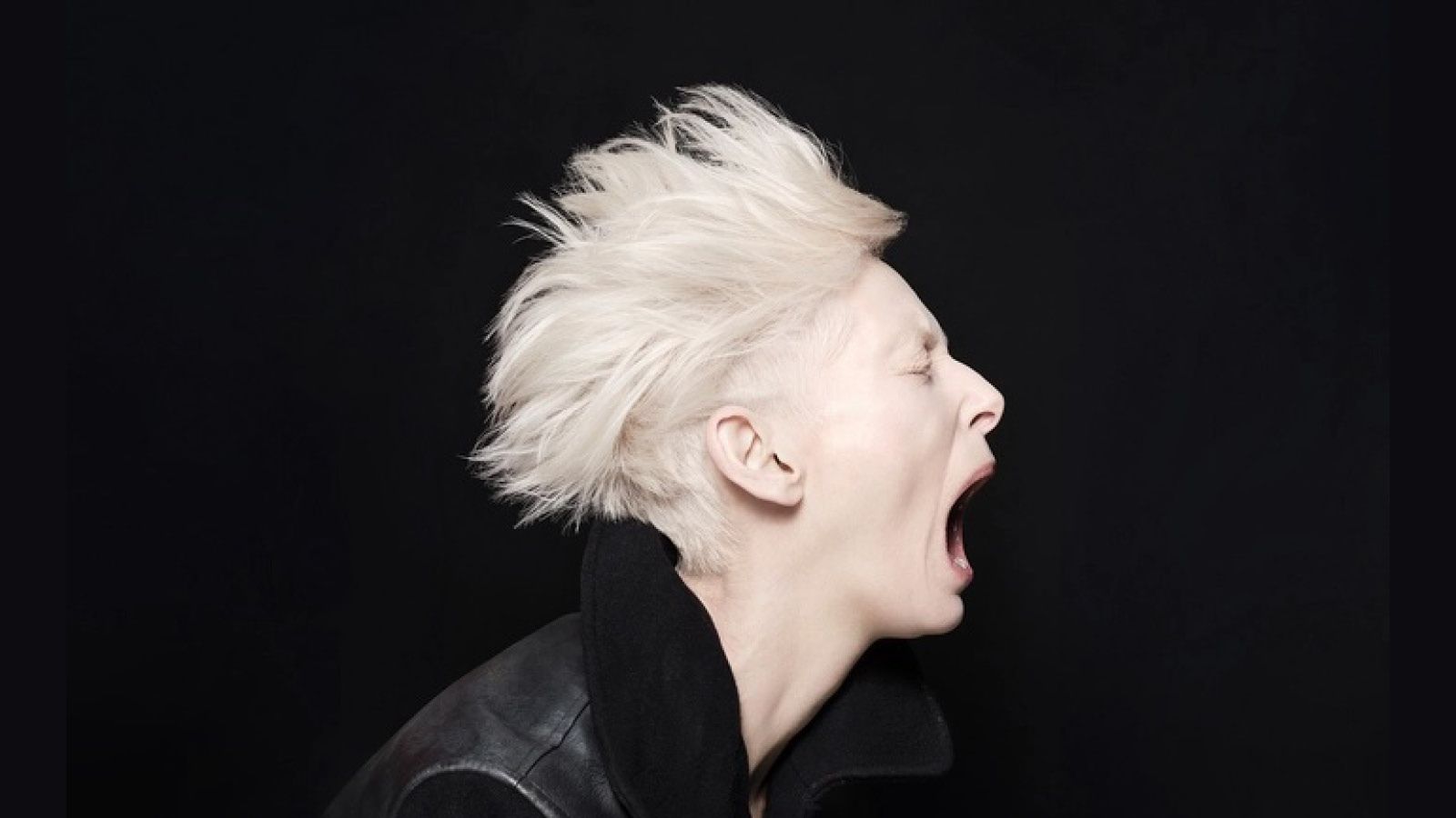 Profile image of Tilda Swinton man screaming on a black background.