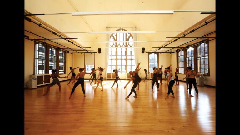 Students dancing together in a workshop.