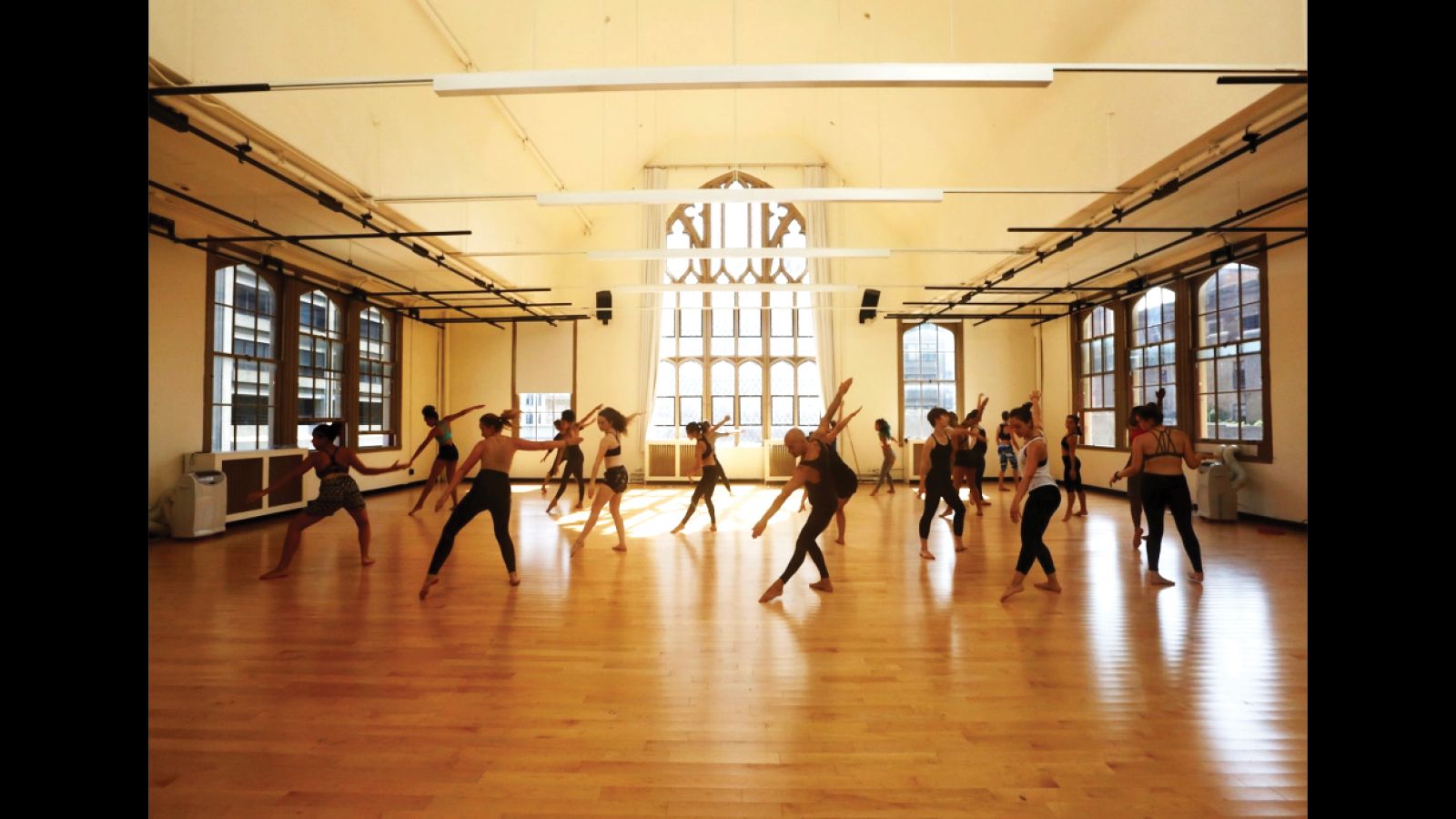 Students dancing together in a workshop.