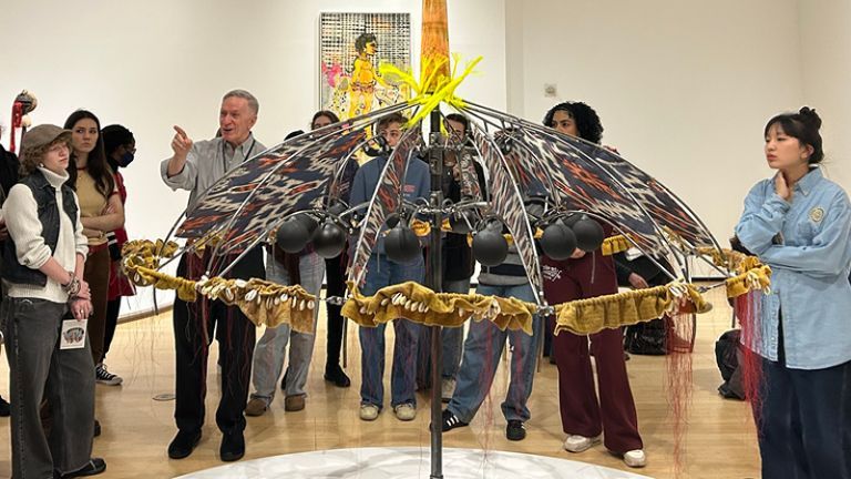 Student admiring art at Asia Society Museum.