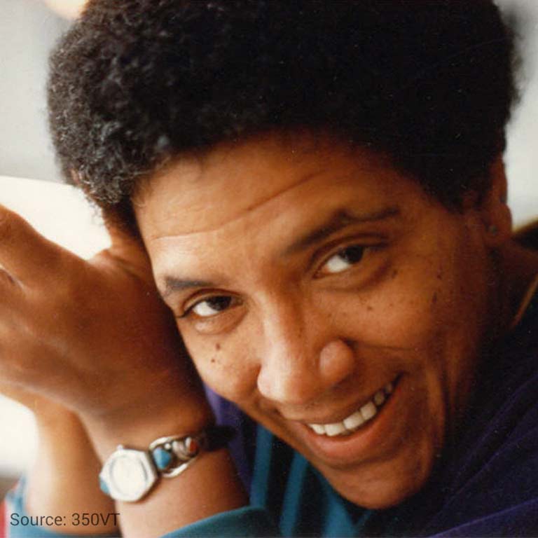 Photo of Audre Lorde smiling at the viewer