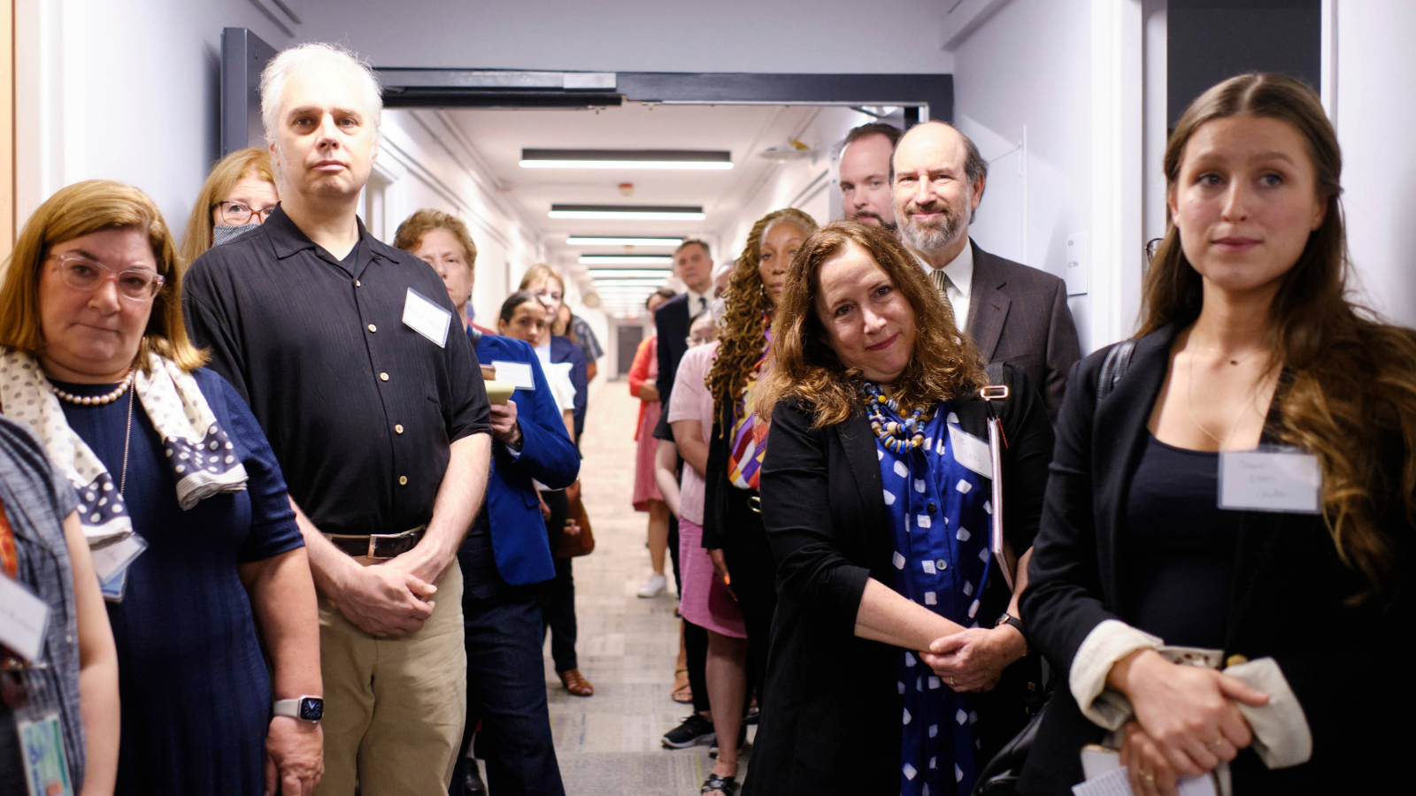 Faculty and Staff standing outside the Brookdale hallway