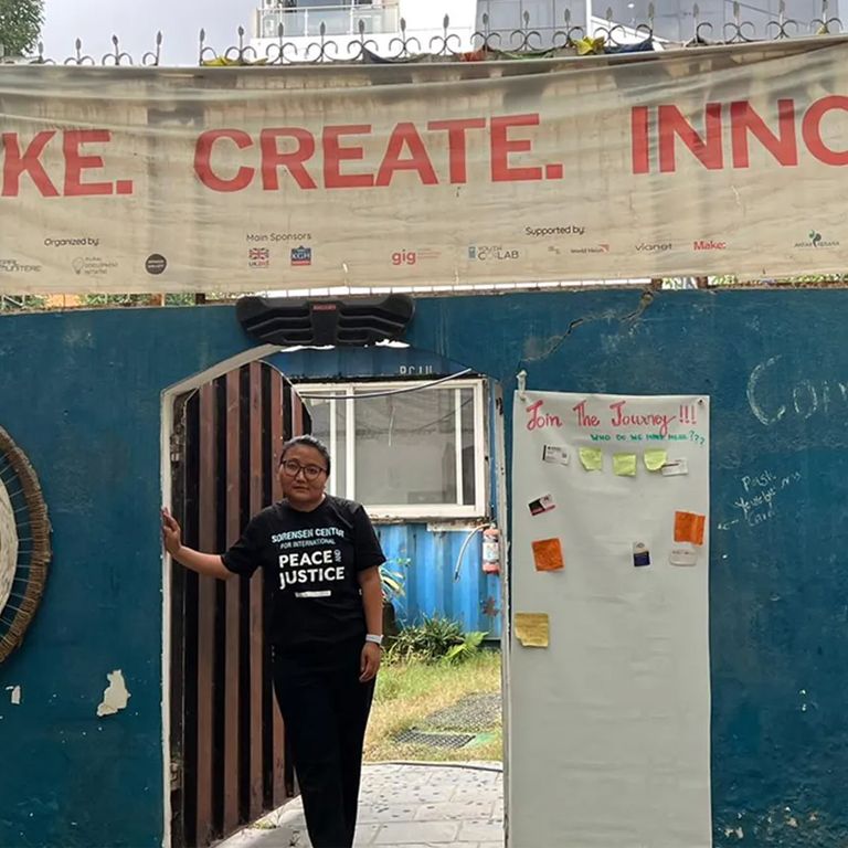 A person standing in a door way