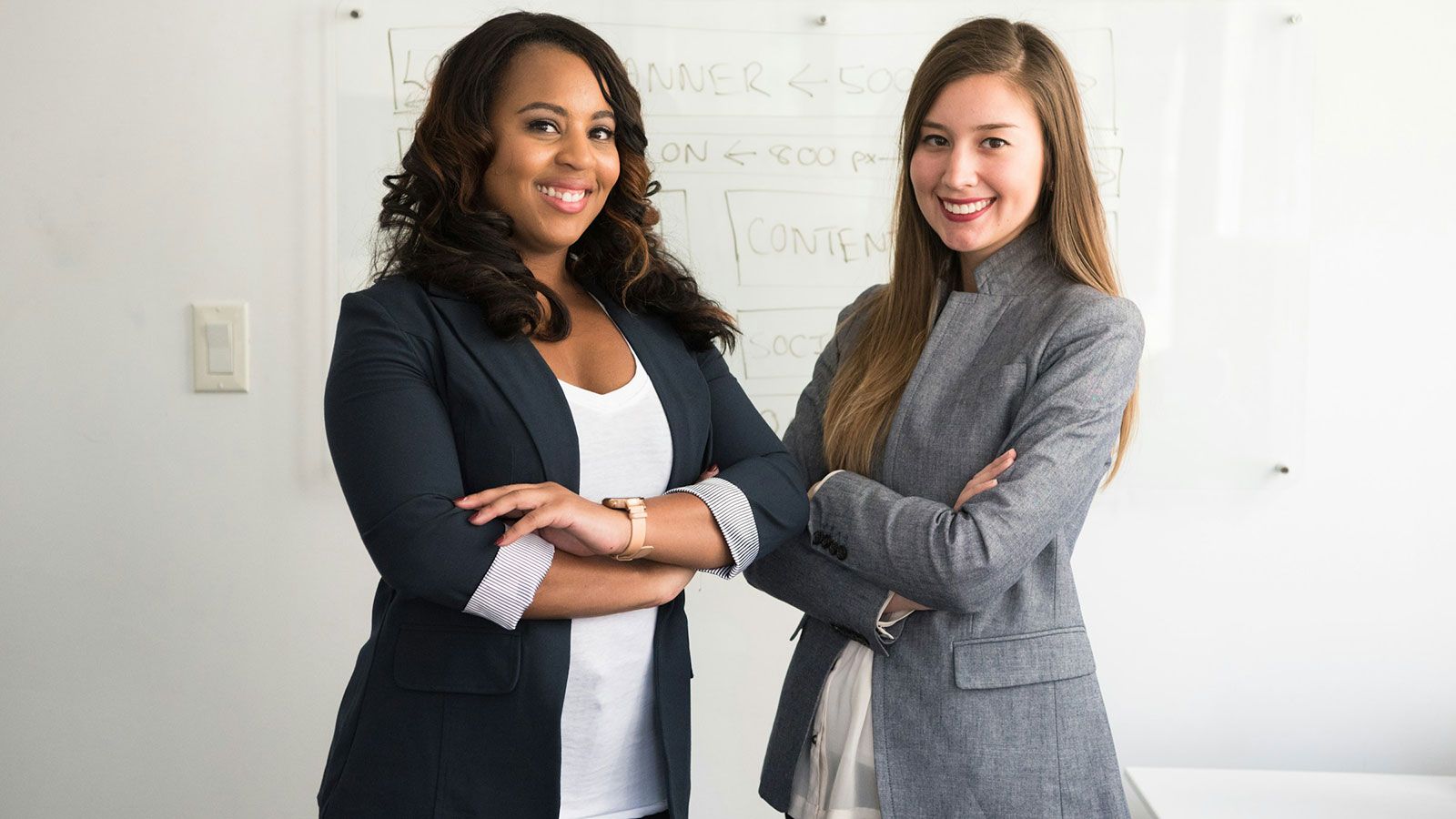 Two women in business attire