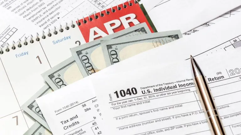 Money and tax documents on a desk