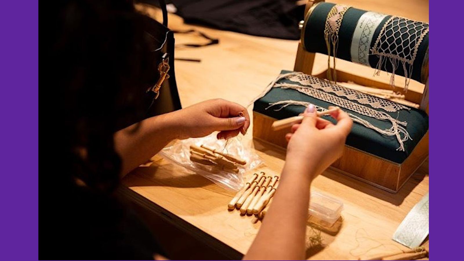 Glorimar Garcia with her mundillo pillow and lace samples winding bobbins at the Lacemakers’ Studio at Bard Graduate Center, 2022.