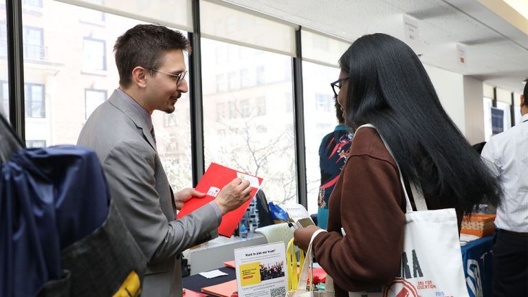 student talking to a recruiter at the internship fair