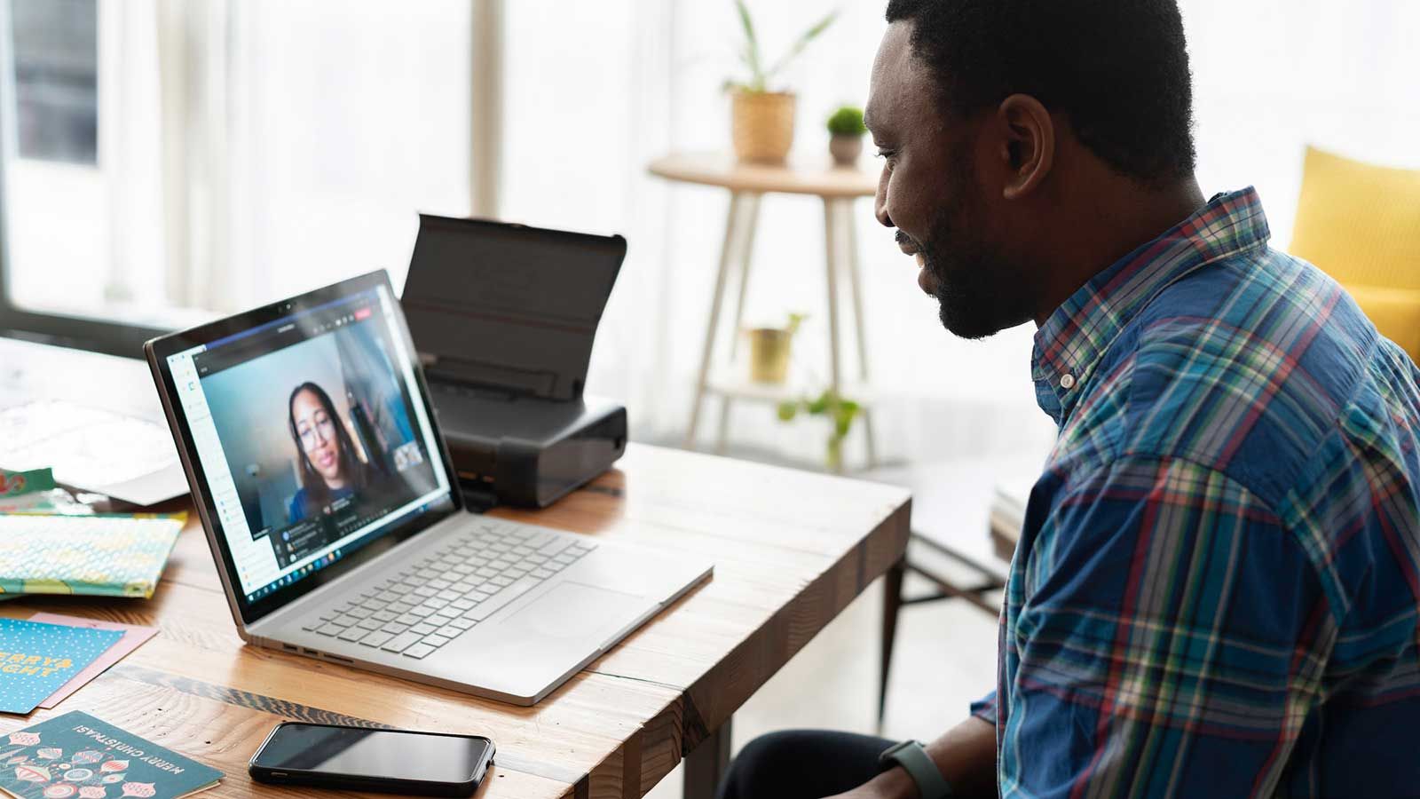 photo of a student being interviewed on a laptop