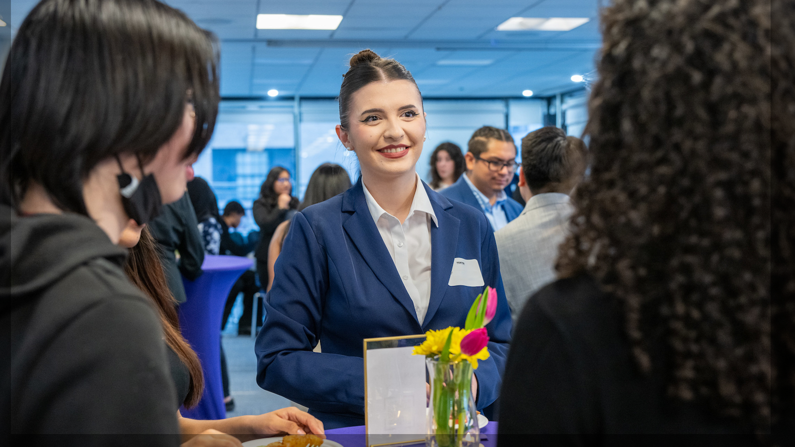 woman in blue blazer at the business at hunter open house