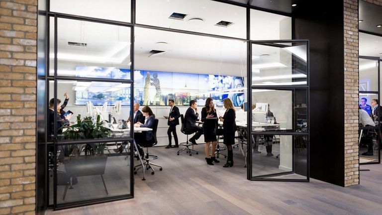 Photo - Employees meeting in an office at Deutsche Bank