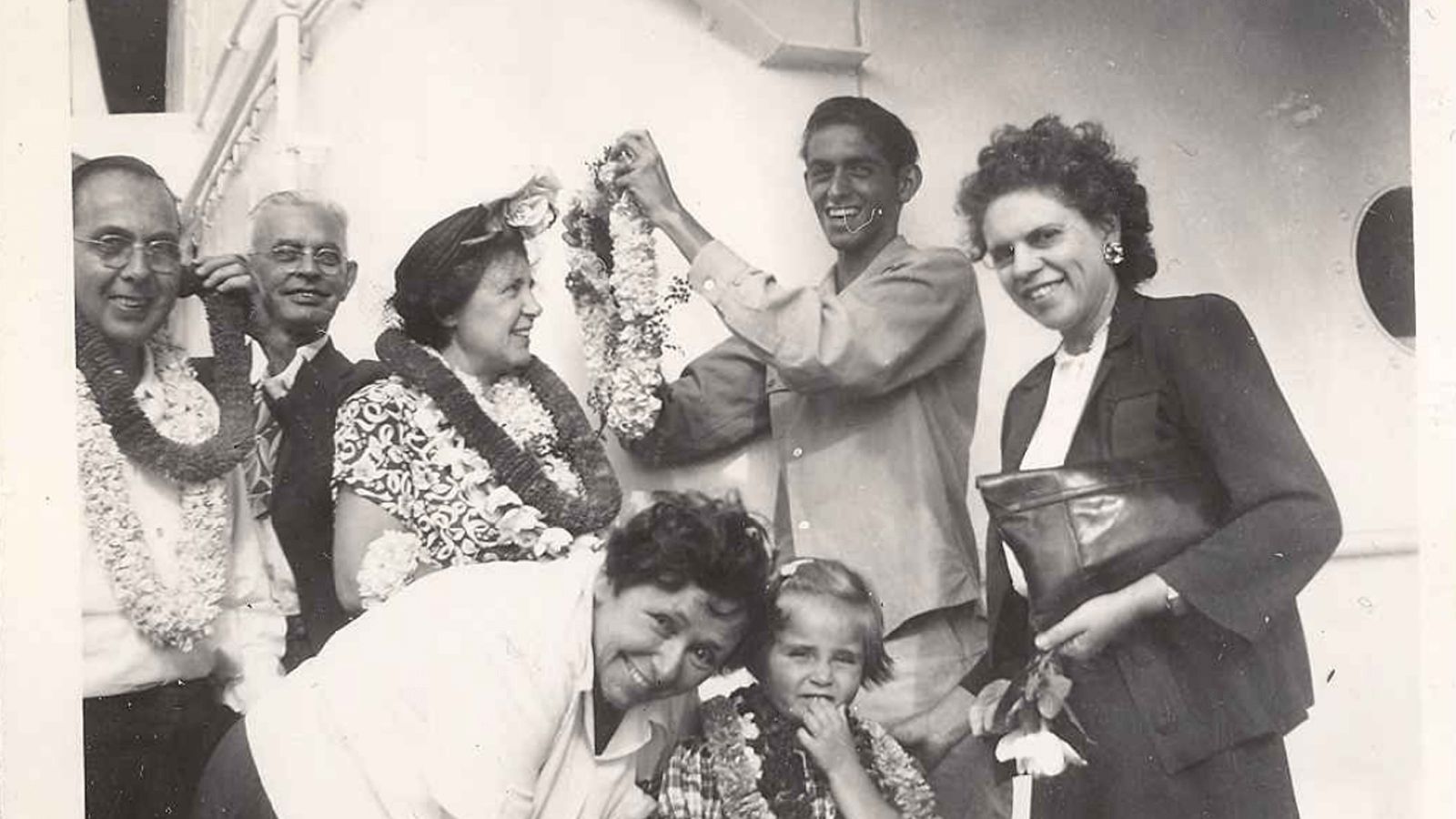 People smiling and wearing leis, Blase Camacho Souza Papers, CENTRO Archives