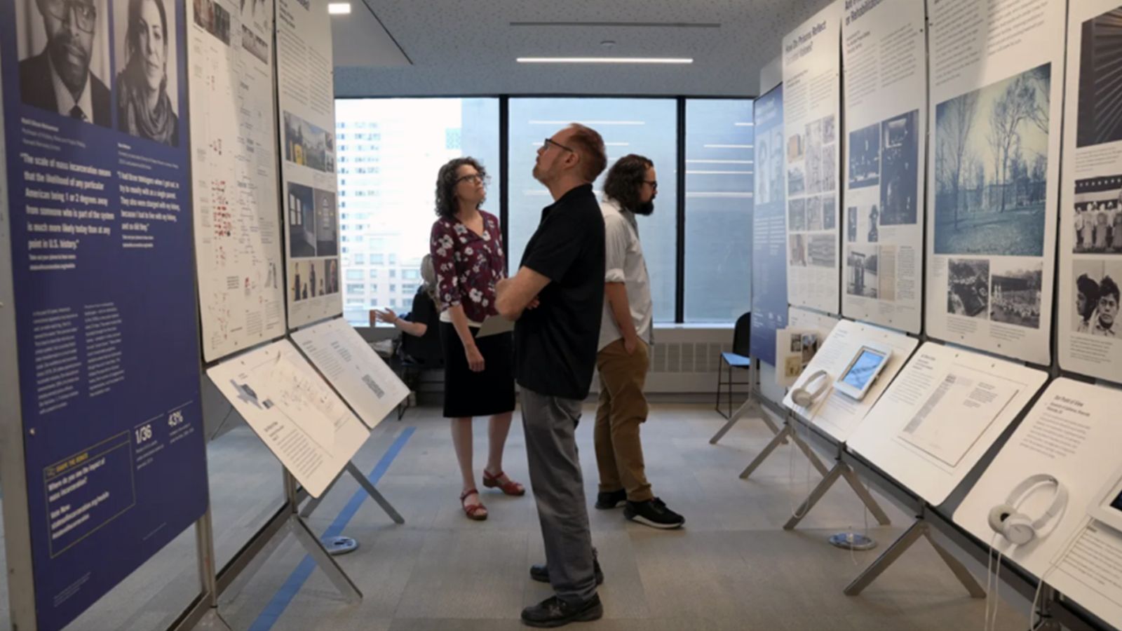 People looking around at an exhibit