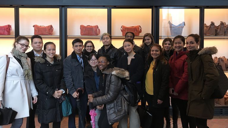 Group of Hunter Students standing in front of the Tapestry Office