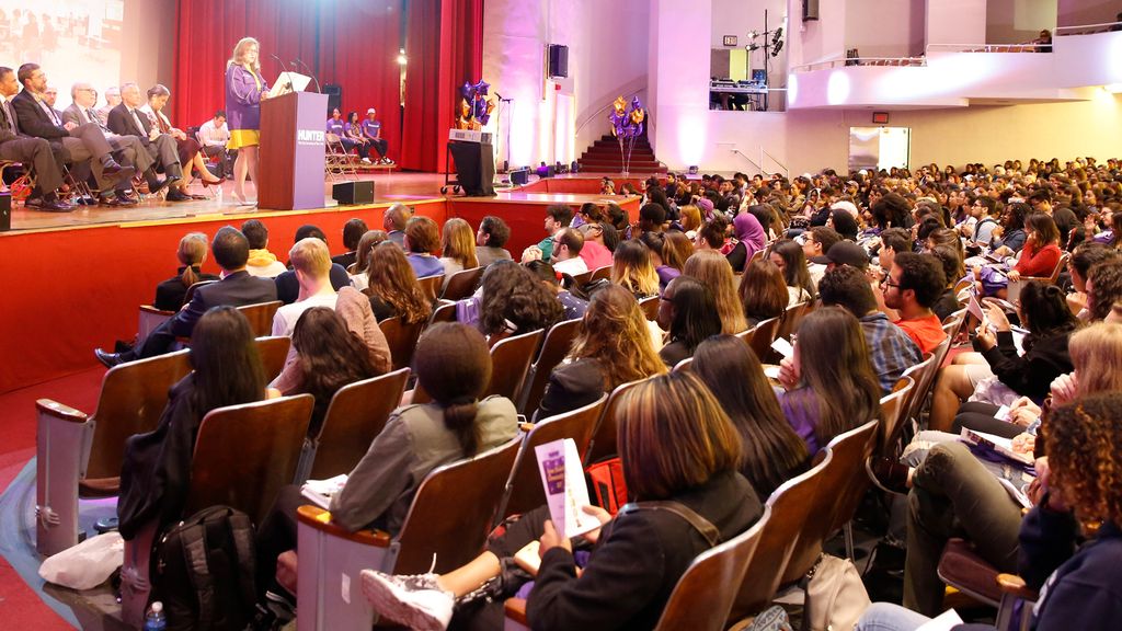 Photo of incoming Hunter students being addressed by the College president convocation in the Assembly Hall