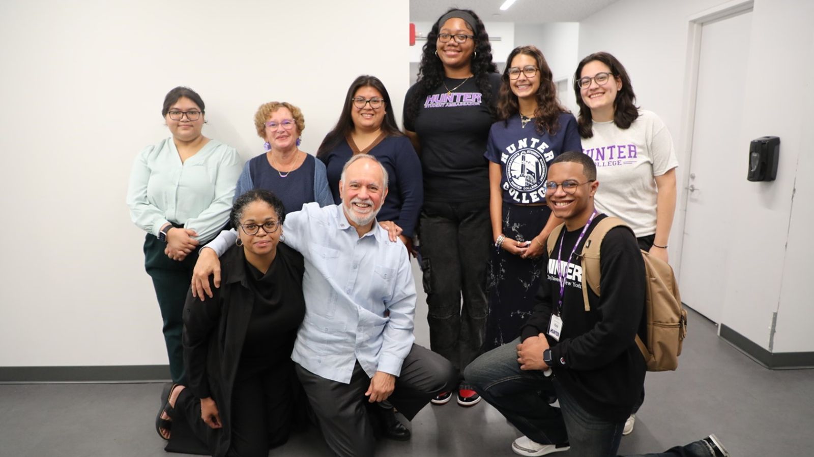 CUNY Chancellor Félix V. Matos Rodríguez (kneeling, second from left) and Hunter College President Nancy Cantor (standing, second from left) greet students on the first day of classes.