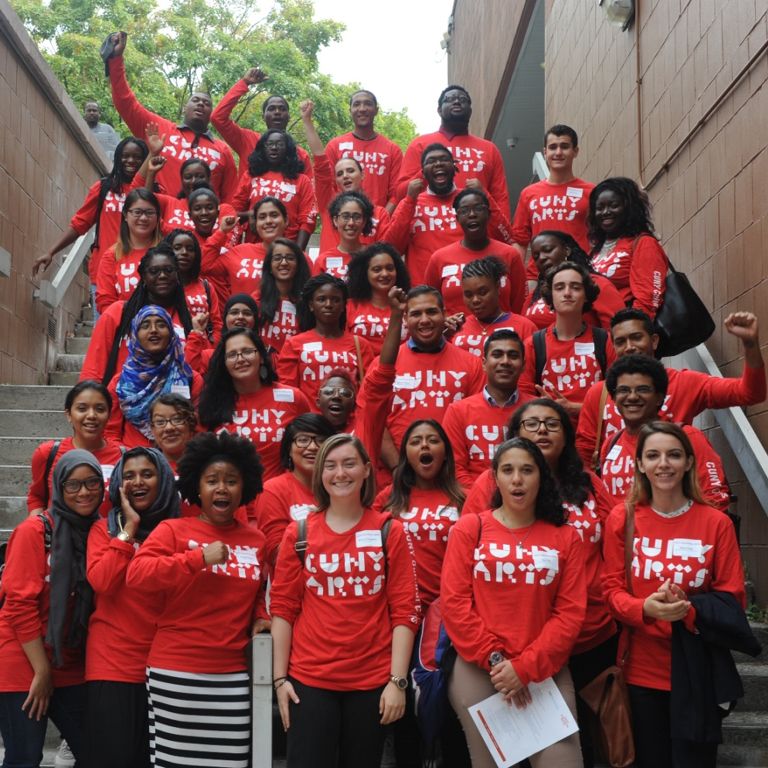 CUNY Cultural Corps students post for a photo in matching shirts