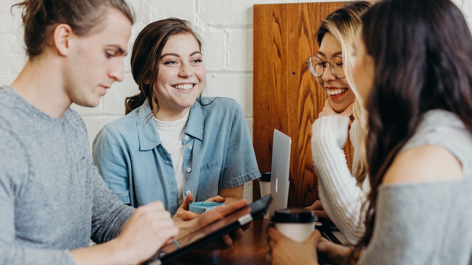 Group of people at a table having a conversation