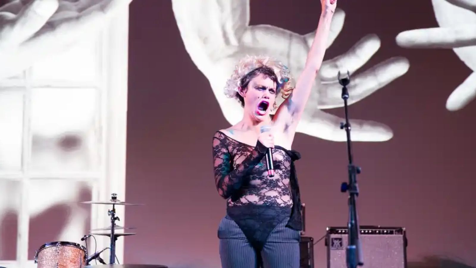 Performer singing on stage