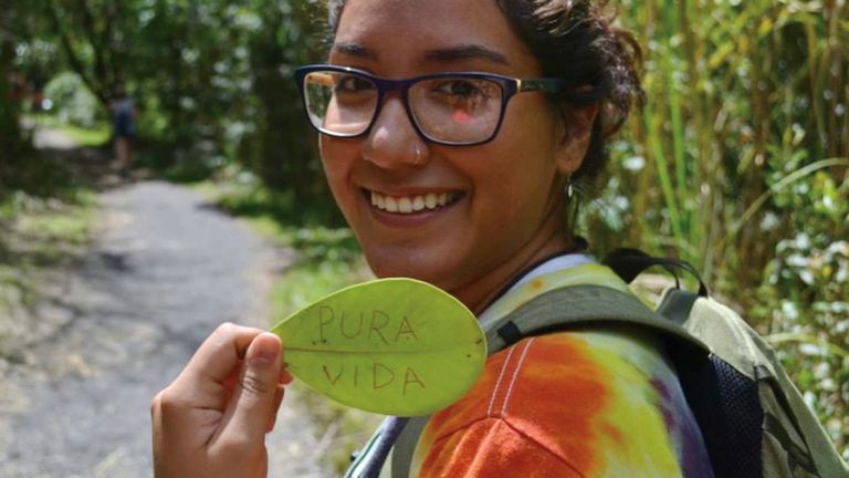 hunter student holding leaf in Costa Rica