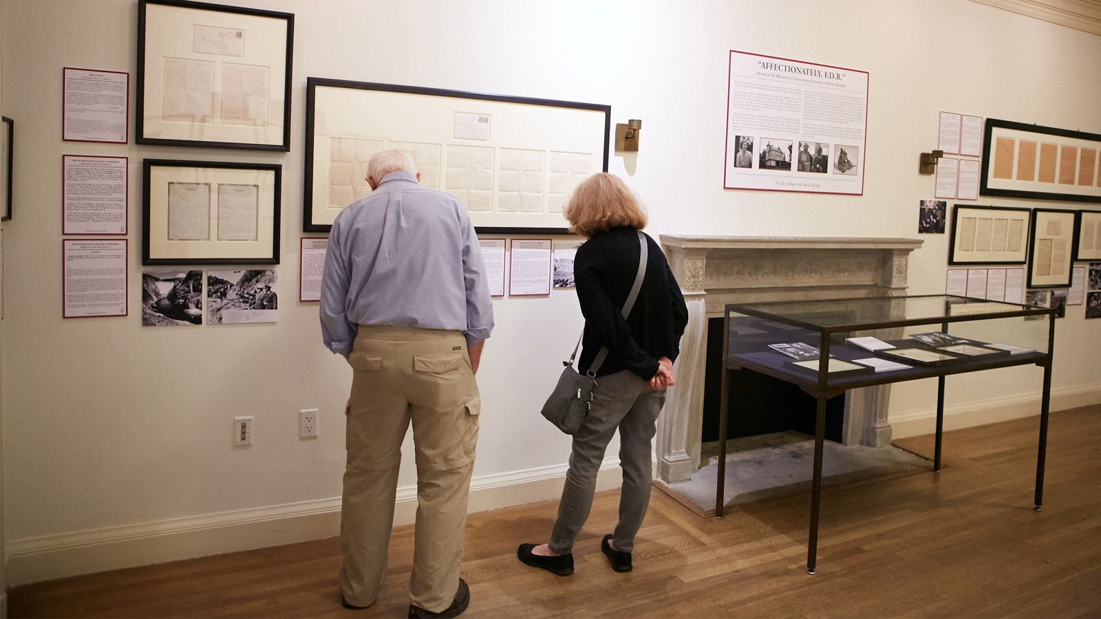 Two people looking at the FDR letters