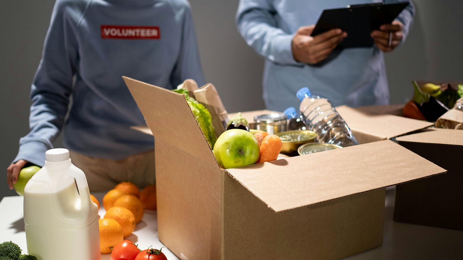 food bank volunteers with boxes of fresh food