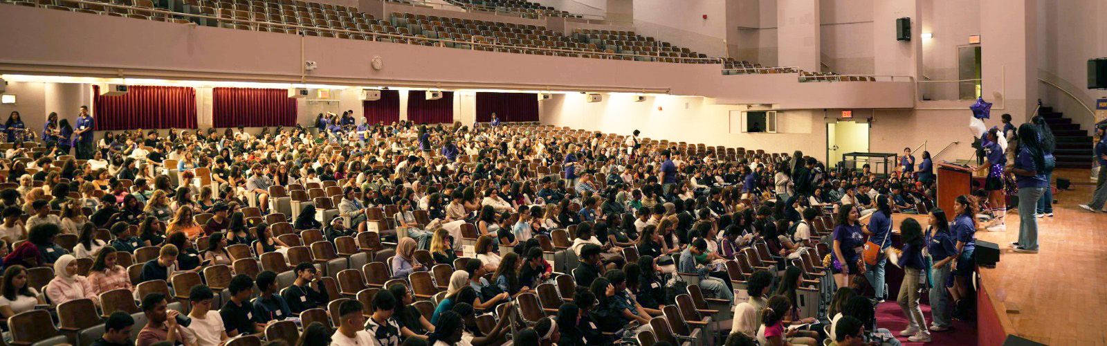 freshman orientation in lecture hall.