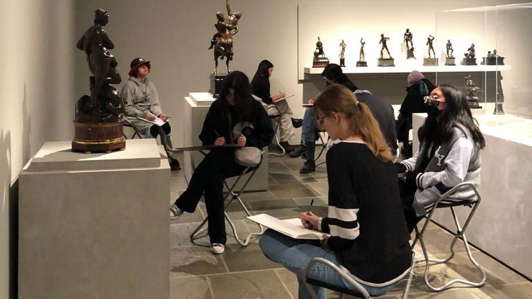 Students sketching statues at the Frick Collection.