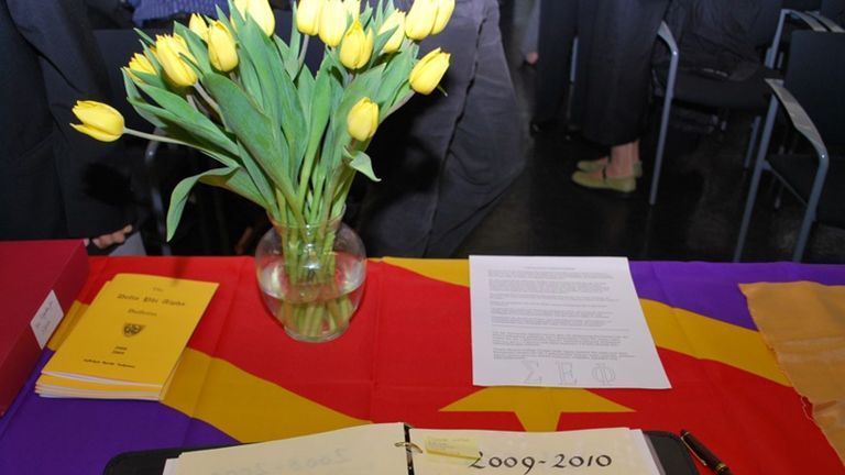 Table set up with materials for the German Honor Society at Hunter College.