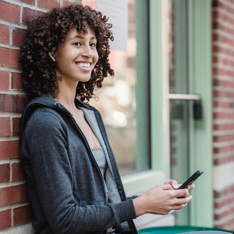 girl leaning on wall