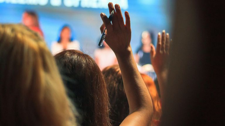 Person raising their hand