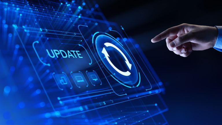 Hand about to press update button on touchscreen