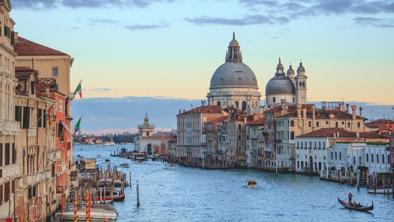 Canals of Venice, Italy with domed buildings in the background