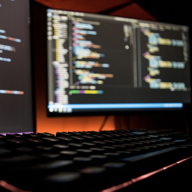 computers with code on screen