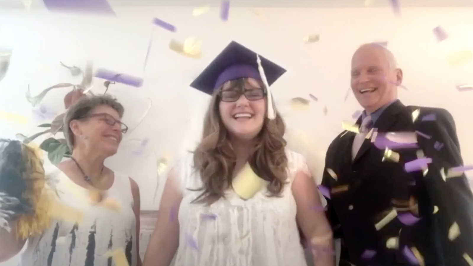 Student celebrating online graduation