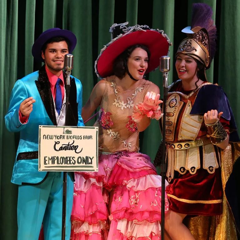 Student sing on stage during performance of As You Like It.