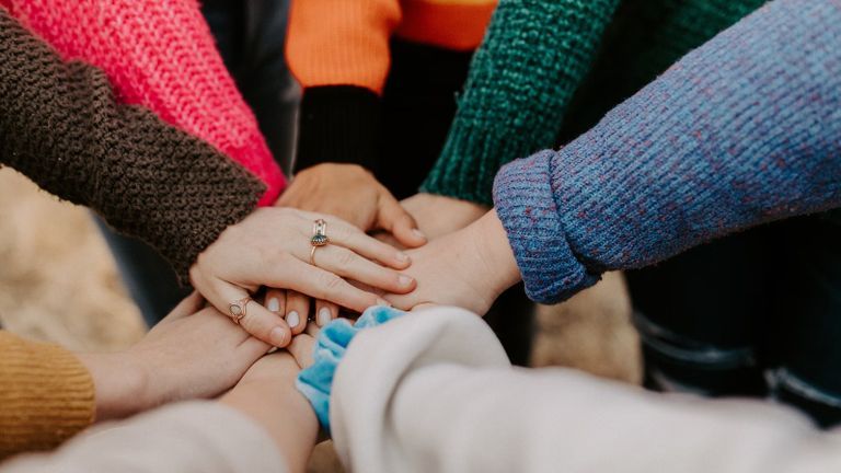 Hands together in a circle.