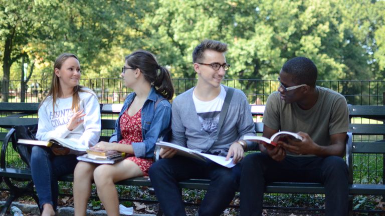 Hunter Students sitting on a bench in Central Park