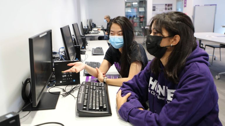 Hunter Students using a computer.