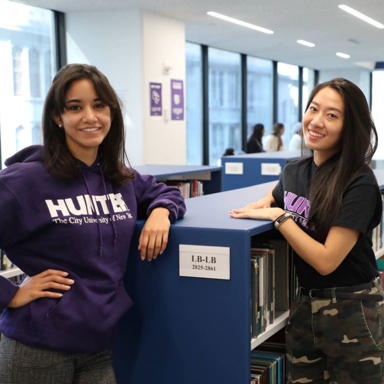 Hunter College Students in the library.