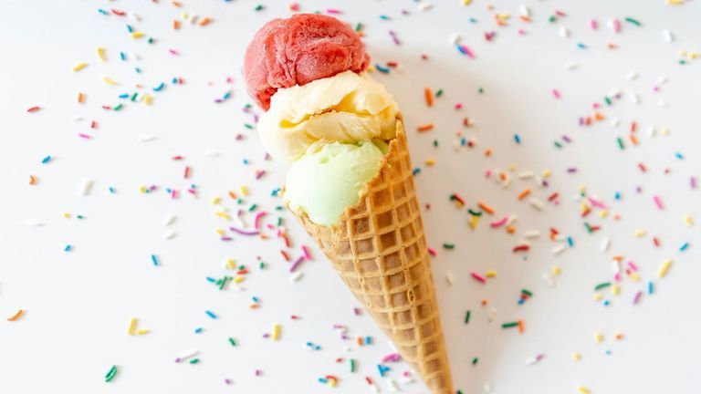 ice cream cone on a white background with sprinkles