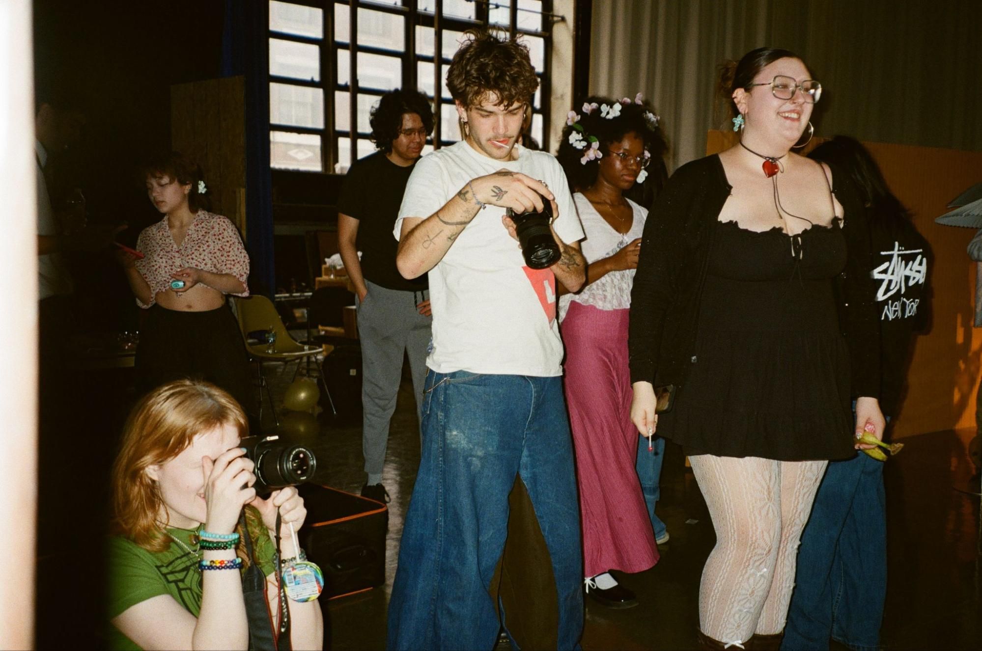 Students take photos during a photography event.